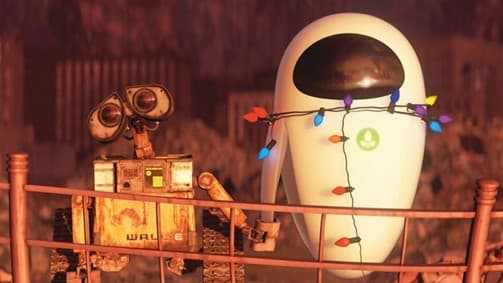 Wall-E and Eve stand together on a railing, with Eve adorned in colorful lights.